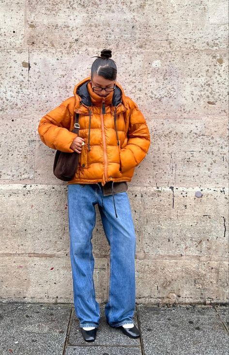 orange puffer jacket with blue wide leg jeans and black tabi shoes Orange Puffer Jacket Outfit, Black Glasses Outfit, Oversized Puffer Jacket Outfit, Puffer Jacket Outfit Oversized, Puffer Jacket Outfit Aesthetic, Puffer Jacket Brown, Orange Puffer Jacket, Puffer Jacket Outfit, Oversized Puffer Jacket