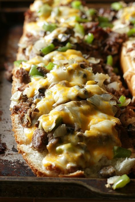 Making a delicious and extra cheesy Philly Cheese Steak is easier than you think with this simple recipe. Perfect for a family dinner or feeding a crowd. Steak For A Crowd, Pumpkin Chocolate Cheesecake, Best Philly Cheesesteak, Slab Pie Recipes, Frozen Steak, Philly Cheese Steak Recipe, Cheesesteak Recipe, Pumpkin Pie Bars, Cheese Steak