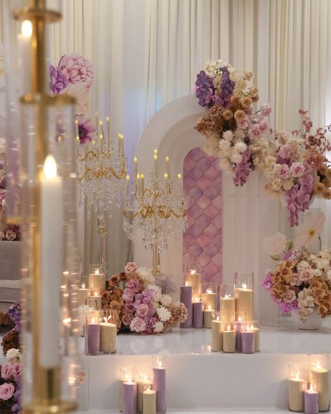 A distinct and unforgettable look: our reception stage with unique purple and warm nude latte florals. Styling, decor, flowers and set up by @museweddingsandevents Candles by @rosewood.candles Photography by @picturethis.photographysydney Venue @novellaonthepark Stage wrap by @ido_dancefloors Chandeliers by @chandelierstodiefor Draping by @sydney_backdrops Mauve Wedding Decor, Purple Wedding Reception, Xv Ideas, Reception Stage, Wedding 101, Mauve Wedding, Candles Photography, 40th Wedding Anniversary, Purple Decor