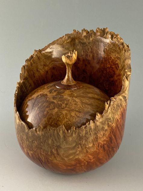 One of a kind Natural edge, lidded bowl turned from an Australian Red Mallee Burl with a Brown Mallee burl lid with finial.  Hand turned and finished to accentuate the natural beauty of the wood. Finished in multiple steps to bring out the beautiful figure of the wood and to seal and protect the turning. Makes a unique keepsake or gift. Ethereal Decor, Turned Boxes, Turned Vase, Wood Turned Bowls, Woodturning Art, Wood Burl, Turned Art, Bowl Turning, Wooden Kitchen Utensils