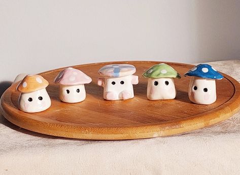 These cute ceramic clay mini mushrooms are a perfect gift for your loved ones or for yourself. I have made them myself with lots of love and care, sculpted, painted and fired at a high temperature for final finished product. price is for 1 mushroom. Buy 1 or begin your collection. approximate H - 3cm W - 3 cm Clay Crafts Painting, Diy Mini Figurines, Clay Sphere Holder, Small Diy Clay Ideas, Cute Mini Sculptures, Easy Things To Make In Ceramics, Miniature Clay Sculptures, Small Ceramic Figures, Clay Garden Sculptures