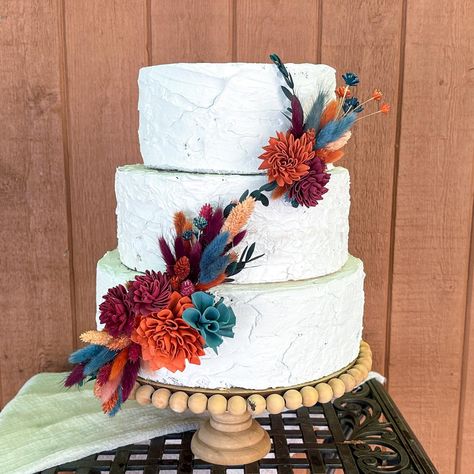 Beautiful shades of burnt orange, teal and burgundy blend to make stunning cake decor in jewel tones that look beautiful together, draped up the cake, or separately.  They will turn a plain cake into something really special and unique.  Perfect for a fall rustic wedding, bridal shower, baby shower or special birthday.   Each are made with preserved flowers, Sola wood flowers, lagurus (bunny tails), phalaris and avena and teardrop eucalyptus and will last long after your event.  The pieces can b Teal Burnt Orange And Burgundy Wedding, 2 Tier Fall Wedding Cake, Teal And Rust Wedding Cake, Dark Teal And Rust Orange Wedding Cake, Teal And Burnt Orange Wedding Arch, Teal And Orange Wedding, Burnt Orange And Teal Wedding, Floral Recipes, Barn Wedding Cake