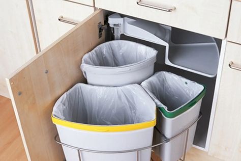 Need multiple trash bins? Have a deep or corner cabinet that’s underutilized? Have we got a find for you. It may be a little weird to geek out over a trash can setup, and yet that is what’s happening here. This compact, under-the-cabinet three-trash-bin setup is so smart! I’m just imagining standing over the bins: “And YOU, bottle, go here (plink!), and YOU, food scraps, go here (plop!), and YOU, old newspaper, go here (drop!). Now swing back under the cabinet! Blind Corner Cabinet Solutions, Kitchen Corner Cabinet Ideas, Kitchen Corner Ideas, Cozy Kitchen Ideas, Corner Cabinet Solutions, Corner Cabinet Organization, Corner Base Cabinet, Trash Can Cabinet, Narrow Cabinet