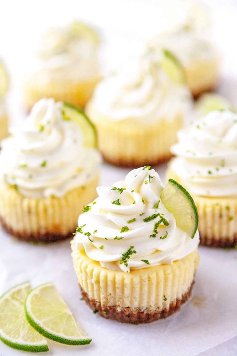 These Mini Key Lime Cheesecakes are the perfect combination of creamy, tart, and sweet in the cutest little cakes. Quick and easy to make using a muffin pan and paper liners. #cheesecake #mini #keylime #lime #dessert #recipe #easy #baked Key Lime Whipped Cream, Creamiest Cheesecake, Key Lime Cheesecake Recipe, Key Lime Pie Cheesecake, Cheesecake Base, Key Lime Rum Cream, Cheesecake With Whipped Cream, Key Lime Cheesecake, Rum Cream