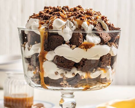 Serve this easy-to-make trifle any time you need a showstopping treat. Turtle Brownie Trifle   Save Recipe Print Makes 1 (4-quart) trifle Ingredients 2 (18.3-ounce) boxes brownie mix* 6 large eggs ½ cup water 1 cup vegetable oil 3 (8-ounce) containers frozen whipped topping, thawed 1 cup chopped toasted pecans, divided 1 cup prepared caramel … Brownie Trifle Desserts, Turtle Brownie, Brownie Trifle Recipe, Heaven In A Bowl, Trifle Bowl Recipes, Trifle Dessert Recipes, Turtle Brownies, Brownie Trifle, Cheesecake Trifle