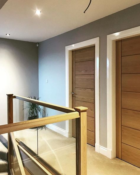 • our upstairs hallway. Oak doors with oak and glass banister. Light grey paint on the walls. Still needs a few pictures and a plant. #upstairs #hallwayideas #glassbalustrade #oak #interiordesign #homedecor White Oak Interior Doors, Upstairs Hallway Decorating, White Oak Interior, Garden Staircase, Interior Doors Modern, Oak Interior Doors, House Staircase, Light Gray Paint, Hallway Inspiration