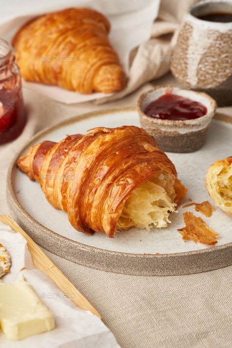 Two delicious croissants on plate and hot drink in mug, side view, vertical by Natabuena. Two delicious croissants on plate and hot drink in mug. Morning French breakfast with fresh pastries and jam. Light g... #Sponsored #mug, #drink, #view, #side Croissant With Jam, Croissant Photography, Morning Pastries, Fresh Pastries, Breakfast Croissant, French Croissant, Fruit Pastries, Croissant Breakfast, French Breakfast