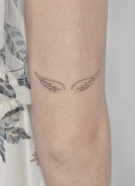 Minimalist Tattoo Angel Wings, Small Detailed Angel Wing Tattoo, Angle Wings Tattoo Tiny, Angel Wings Tattoo Back Of Ankle, Woman Small Neck Tattoo, Angel Wing Minimalist Tattoo, Dainty Wing Tattoo, On Eagles Wings Tattoo, Angel Wing Small Tattoo