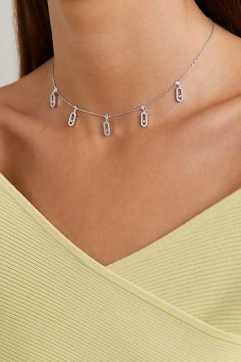 Messika's 'Move Uno' collection is defined by a central diamond which glides freely within a delicate pavé-set charm. The signature design is replicated and showcased in this stunning 'Tassel' choker, which has been handmade from 18-karat white gold. Style yours with an off-the-shoulder top and scarlet lipstick.  Each Messika piece comes with a two-year warranty, which is activated 28 days after purchase. To receive an additional year's warranty, register your piece on Messika's website. Messika Jewelry Aesthetic, Designer Pave Setting Jewelry, Designer White Gold Jewelry With Pave Setting, Designer Diamond Necklace In White Gold, Designer Diamond Accented Jewelry, Modern Diamond Necklace With Vvs Clarity, Modern Diamond White Necklace, Platinum Diamond Necklace With Pave Setting, Modern White Diamond Necklace