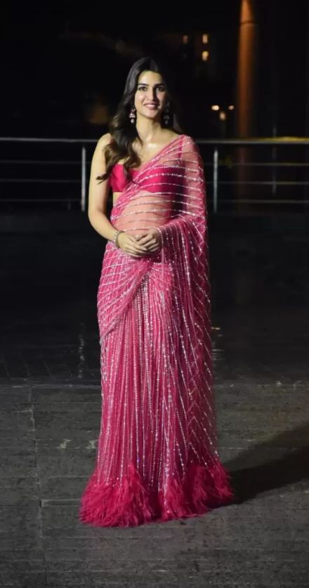 Custom Falguni Shane Peacock saree-gown in fuchsia pink, encrusted with Swarovski stones, sequins and beads, that is styled with a bralette-style blouse. Kriti Sanon Saree, Falguni Shane Peacock, Kriti Sanan, Editing Photos, Saree Gown, Simple Sarees, Kriti Sanon, Net Saree, Desi Girl