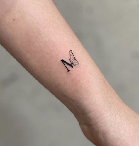 Unique Initial Tattoos, Butterfly With Initials Tattoo, Butterfly Initial Tattoo, Butterfly Friendship Tattoos, Minimalist Friendship Tattoos, Mini Friendship Tattoos, M Letter Tattoo, Letter M Tattoos, Infinity Tattoos For Couples