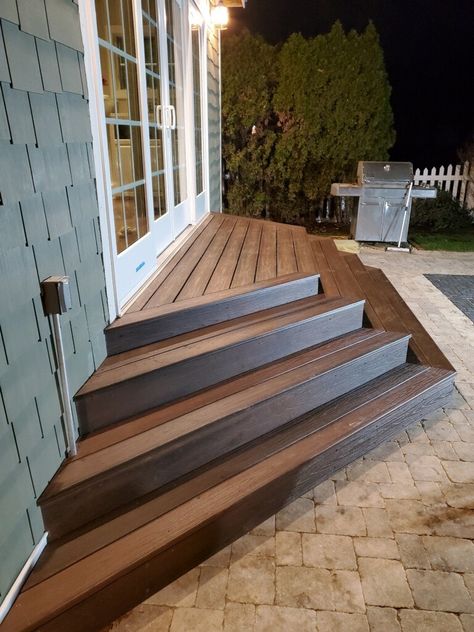 Steps From Deck To Yard, Stairs To Deck Ideas, Wood Stairs On Concrete Patio, Concrete Patio With Stairs From House, Backyard With Stairs, Steps To Backyard Patio, Back Patio Stairs Ideas, Steps With Landing Outdoor, Corner Patio Steps