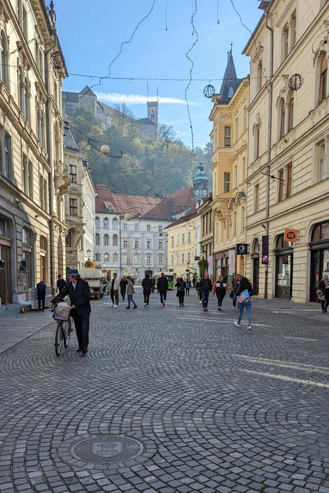 Looking up to Ljubljana Castle, Old Town Ljubljana, Slovenia. To take a day trip you'll remember forever and for more Travel Inspo, check out Wonder & Sundry! Slovenia Aesthetic, Ljubljana Aesthetic, Ljubljana Photo Ideas, Ljubljana Slovenia, Ljubljana Slovenia Aesthetic, Ljubljana Architecture, Ljubljana Slovenia Winter, Ljubljana Castle, Ljubljana Slovenia Instagram