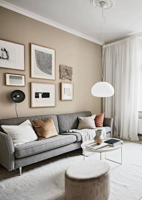 Small studio with beige walls - via Coco Lapine Design blog  // Shop now at www.wallandroom.com Follow us on instagram: @wallandroom One Colored Wall Living Room, Living Room One Wall Different Color, Rooms With Beige Walls, Wall Paint For Small Living Room, Beige Color For Living Room, Living Room Decor Beige Walls, Sandy Wall Color, Small Paintings On Wall, Modern Wall Colors Living Room