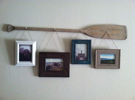 Rustic oar picture hanger... Old worn out wooden oar with hooks and rustic picture frames. Colors textures work well with rustic or nautical decor! Still trying to figure out if I want to paint or stain the oar, or keep it natural? Wooden Oars, Deco Marine, Nautical Bedroom, Wooden Paddle, Farmhouse Side Table, Lake Decor, Cute Dorm Rooms, Nautical Bathrooms, Nautical Home