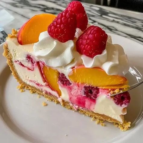 Peach Raspberry Cheesecake: Summery Dessert Recipe - optimal recipes Peach Raspberry Cheesecake Recipe, Peach Raspberry Cheesecake, Optimal Recipes, Cheesecake Fruit, Peach Cheesecake, Fruit Cheesecake, Fancy Desserts Recipes, Peach Raspberry, Raspberry Desserts