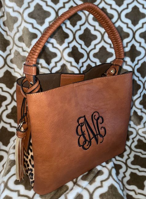 THIS IS A GORGEOUS BAG Hurry! Only 6 left Beautiful faux leather with shoulder strap and braided short strap included that you are going to love! Personalize yours with your name or monogram at no extra charge. Animal Print Contrast Hobo Monogrammable Top snap closure Removable crossbody strap Removable dual decorative tassels Braided handle Dimensions: 11'' L x 7'' D x 11'' H FOR MATCHING WALLETS SEE THIS LISTING: https://www.etsy.com/listing/950159055/monogrammed-mini-wallets-great-gift?ref=sh Decorative Tassels, Clarksville Tn, Hobo Handbag, Monogrammed Leather, Brown Leopard, Mini Wallet, Gorgeous Bags, Hobo Handbags, Bags Purses