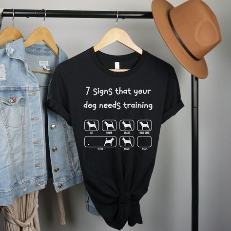 Dog Lover Shirt Funny Animal Tshirt Gift for Her Dog Sitter Tee Dog Trainer Gifts Shirts Dog Training Jokes Pet Groomer Tees Veterinarian by 3DCandleCreations: 17.00 USD Dog Lover Shirt Funny Animal Tshirt Gift for Her Dog Sitter Tee Dog Trainer Gifts Shirts Dog Training Jokes Pet Groomer Tees Veterinarian Introducing our "Seven Signs Your Dog Needs Training" Shirt - the perfect addition to any dog owner's wardrobe! This playful and stylish shirt features a humorous and relatable message, ... Trainers Outfit, Dog Needs, Training Shirt, Funny Dog Shirts, Training Shirts, Dog Lover Shirt, Stylish Shirt, Animal Tshirt, Dog Trainer