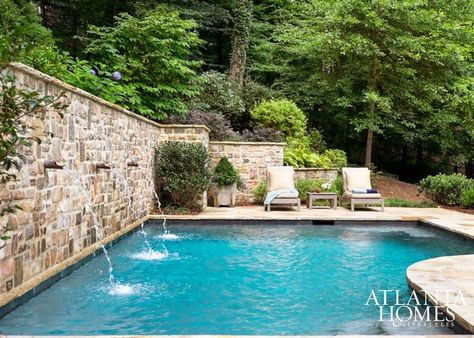 Retaining wall with water jets Pool Retaining Wall, Hillside Pool, Pool Water Features, Pool Remodel, Backyard Pool Landscaping, Dream Pools, Atlanta Homes, Backyard Pool Designs, Stone Walls