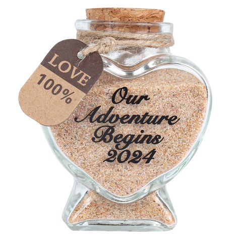 PRICES MAY VARY. HONEYMOON GIFTS: Newlyweds travel sweet memories decorative bottle that can hold sand, soil, leaves...and best memories. NEWLYWED GIFT: Giving you and your lover most loving memories again and again; This is the perfect wedding for couples, which will make you think of your love in the years after your honeymoon. HANDMADE JARS: Each "Our Adventure Begins 2024" LOGO is hand-printed by workers, and the text will not fall off or fade.Love heart shape glass bottle,made of transparen Honeymoon Jar, Sand Keepsake, Gift Ideas For Bride, Our Adventure Begins, Wedding Gifts For Couple, Destination Wedding Gifts, Travel Gift Ideas, Engagement Gifts Newly Engaged, Honeymoon Gifts