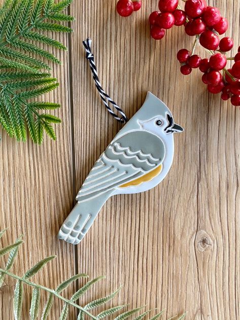 "This ceramic tufted titmouse ornament was handmade by me from start to finish using creamy white clay and vibrant glazes. It would be a colorful addition to your Christmas tree but can also be hung in your home or office year round. DETAILS: ● completely handmade, using one of my own hand drawn designs ● glazes used are glossy and lead free; colors as shown ● backside is left unfinished and is stamped with my maker's mark ● use indoors or outdoors but for longest life, bring inside in areas pro Pottery Tree Ornaments, Ceramic Bird Ornaments, Pottery Christmas Tree Ornaments, Ceramic Xmas Ornaments, Christmas Ornament Ceramic, Ceramic Christmas Decor, Clay Bird Ornaments, Xmas Ceramics, Christmas Pottery Ideas