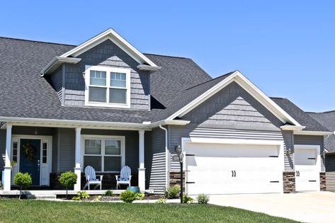 Moire black roof with deep granite grey ... Moire Black Roof, House With Black Roof, Dark Grey Siding, 1920 Bungalow, White Garage Doors, Carriage Style Garage Doors, Grey Siding, Shake Siding, Black Roof