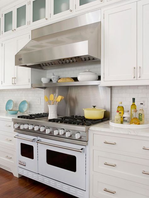 Love the Viking stove! #9 Keep It Current. For a new look a few years from now, just change your cabinet hardware. Switch from subtle white-painted wood knobs to fanciful glass or ceramic accents, or try metal pulls that echo appliances, such as this range hood. Coastal Inspired Kitchens, Viking Stove, Kitchen With White Cabinets, Kitchen Vent, Gimme Shelter, Budget Remodel, Update Cabinets, Kitchen Hood, Outdoor Kitchen Appliances