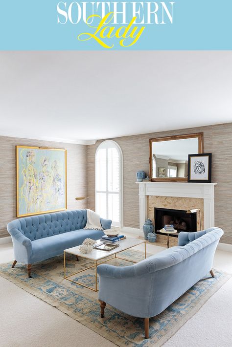 A bright room awash in natural light is home to an elegantly pale blue and white palette. Regal powder blue sofas top a worn blue oriental rug, reflecting the soft colors of nearby collected artwork. Repin for your own design inspiration and visit our website for a digital tour of this beautiful home! Blue Sofa Ideas, Pale Blue Sofa, Light Blue Couch Living Room, Powder Blue Sofa, Light Blue Couches, Blue Couch Living, Banks Design, Light Blue Living Room, Blue Sofa Living