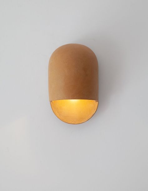 The new Tera Sconce is an extension of Ceramicah's Tera Collection, complementing the studio's already popular Tera Lamp. Wall Arm Lamp, Diy Paper Mache Pendant Light, Ceramic Wall Lamp, Minimal Lighting Design, Wall Pendant Light, Ceramic Light Fixture, Hawaii Garden, Plaster Lamp, Clay Lamp