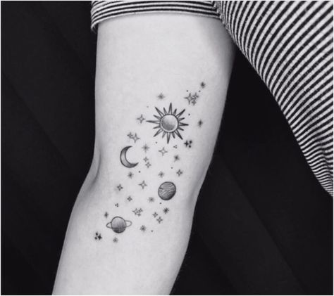 Black and white photo of a galaxy-inspired tattoo on the inner arm. Consists of stars, the sun, the moon in a crescent shape, Venus, and Saturn Space And Ocean, Tattoos Galaxy, Stargazing Tattoo, Galaxy Tattoos, Space Tattoos, Ocean Tattoo, Galaxy Tattoo, Ocean Tattoos, Tattoos For Girls