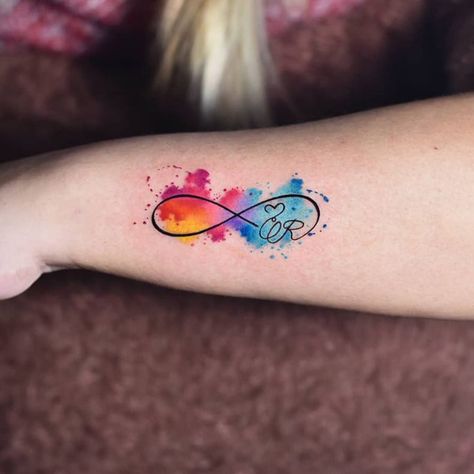 29 Superb Infinity Tattoo Designs Watercolor Infinity Heart Tattoo, Infinity Tattoo Colorful, Infinity Number Tattoo, Neurodivergent Infinity Tattoo, Infinity Color Tattoo, Infinity Watercolor Tattoo, Infinity Tattoo Color, Infinite Tattoo Design, Infinity Tattoo Designs For Couples