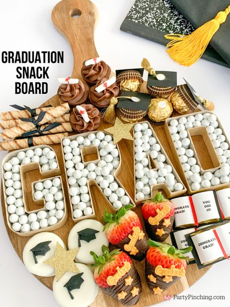 Graduation snack charcuterie treat dessert board, Graduation charcuterie board, Graduation dessert ideas, best graduation dessert food recipe ideas, Graduation cookie dipolmas, Oreo cookie graduation caps, Ferrero Rocher graduation caps, Graduation diploma brownie bites, Graduation Hershey Nuggets books, Graduation chocolate dipped strawberries, Graduation cardboard letter candy dish, Grad charcuterie board Graduation Charcuterie, Graduation Party Snacks, Snack Board Ideas, Graduation Snacks, Graduation Chocolate, Caps Graduation, Dessert Table Graduation, Graduation Open House, Open House Party