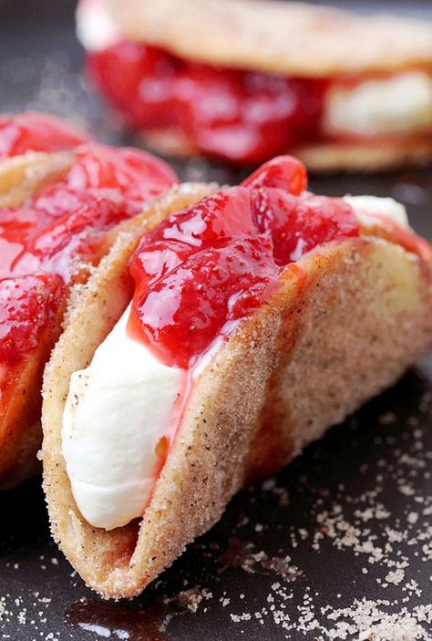 Strawberry Cheesecake Tacos - crunchy cinnamon and sugar tortilla shells, filled with cheesecake and topped with homemade strawberry sauce are perfect bites for every occasion. They are so easy to make, they look great and taste even better.  Strawberry season is about to begin and that makes me really happy, because I love them, especially strawberry desserts. The first thing that comes to my mind when someone mentions strawberries is spring and that makes me feel really good. There are plenty Strawberry Cheesecake Tacos, Cheesecake Tacos, Authentic Mexican Desserts, Taco John's, Dessert Taco, Homemade Strawberry Sauce, Strawberry Breakfast, Tortilla Shells, Recipes Authentic