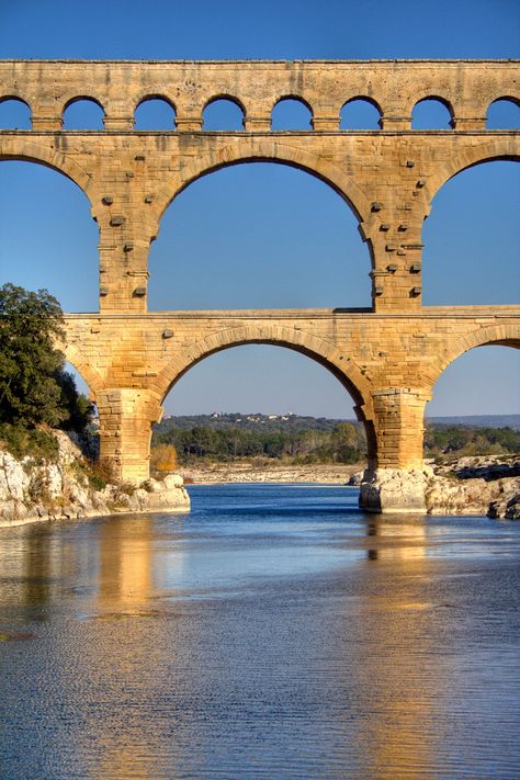 Pont Du Gard, ancient Roman aquaduct in Provence Imperiul Roman, Roman Aqueduct, Roman Architecture, Stone Bridge, Body Of Water, Provence France, Old Stone, Ancient Architecture, Ancient Ruins