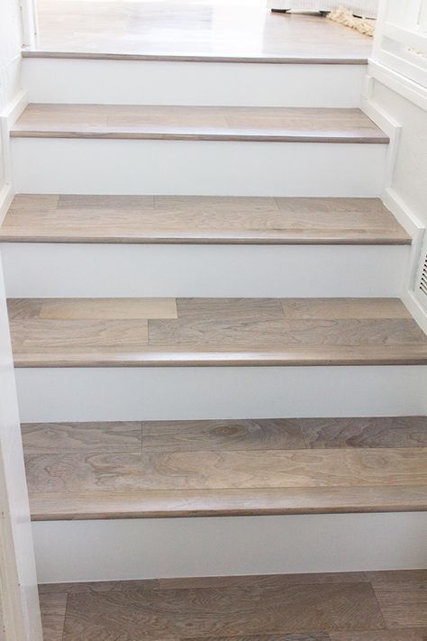 want more of an overhang than this... We have new stair railing! | Jenna Sue Design Blog Laminate Stairs, Transition Ideas, درج السلم, Transition Flooring, Floor Furniture, Hardwood Stairs, Flooring For Stairs, Tile Stairs, Staircase Remodel