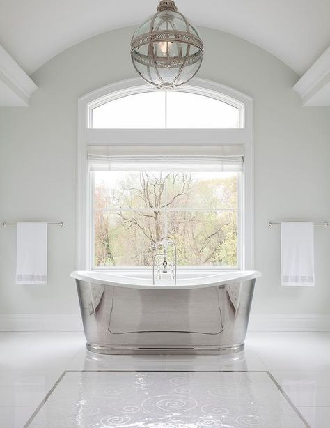 Restoration Hardware Victorian Hotel Pendant illuminates a master bathroom above a silver modern cast iron bathtub designed at a picture window fitted with a white Roman shade. Melanie Turner Interiors, Niche Decor, Silver Bath, Mermaid Bathroom Decor, Kids Bathroom Wall Art, Refinish Bathtub, Cast Iron Bathtub, Jetted Bath Tubs, Bathtub Design