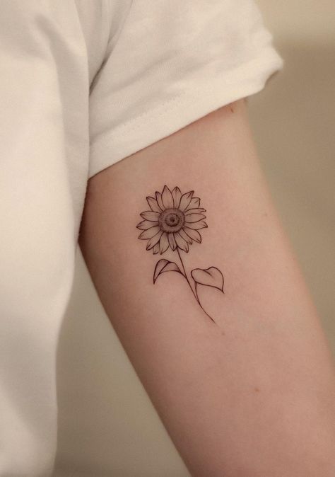 35 Stunning Feminine Sunflower Tattoo Ideas - Days Inspired Sunflower Initial Tattoo, Sunflowers Facing Each Other Tattoo, Sunflower Tattoo No Color, Sunflower Tattoo Shaded, Detailed Daisy Tattoo, Simple Tattoos Sunflower, Sunflower Chain Tattoo, Sunflower Tattoos Black And White, Fine Line Sunflower Tattoo Shoulder