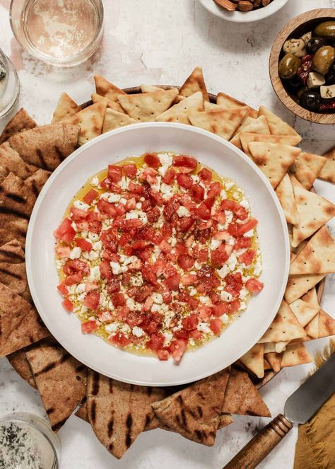 A quick and easy feta tomato dip appetizer with only 4 ingredients. Make it in 5 minutes and serve with pita, crostini or chips. It's a crowd pleaser for girls night, happy hour, or any casual gathering. Healthy Girls Night Snacks, Girls Night In Food Ideas, Girls Night Snack Ideas, Girls Night Recipes, Feta Tomato Dip, Girls Night Food Ideas, Tomato Feta Dip, Girls Night Appetizers, Girls Night Snacks