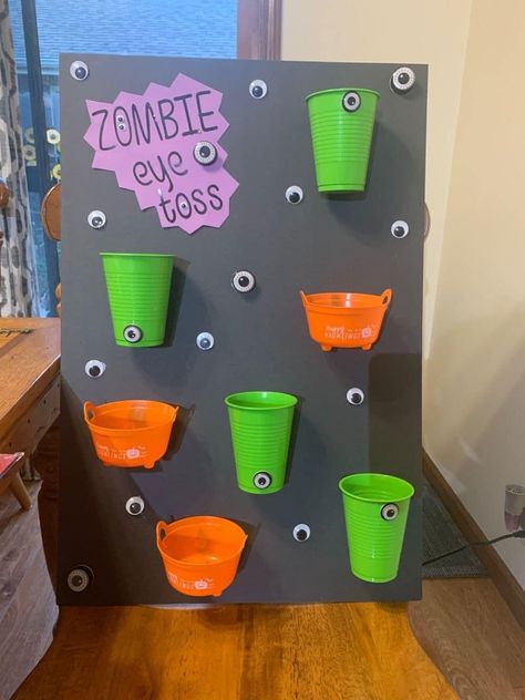 Zombie Birthday Party Games, Halloween Town Birthday Party, Halloween School Event Ideas, Zombie Eyeball Toss Game, Homeroom Mom Halloween Party, Halloween 2nd Grade Party, Zombie Preschool Activities, Halloween Classroom Party Decorations, Fall Classroom Party Ideas Kindergarten