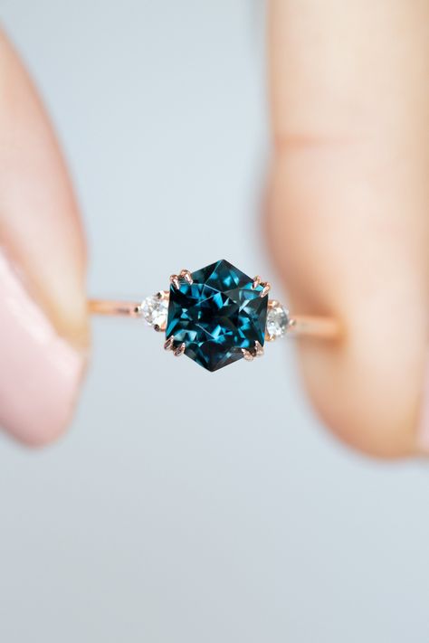 Natural Hexagon Blue topaz is very rare and absolutely extraordinary, especially when complemented with 2 white diamonds on either side. For more about us, please visit:  https://www.diamantladiva.com/ How to measure your ring size at home, please visit: https://www.diamantladiva.com/pages/sizing More videos, please visit: https://www.instagram.com/diamantladiva/ FULL SERVICE FROM OUR TERM - Handmade Fine Jewelry - Natural Real Diamonds & Precious stones - High Quality Materials, Water Safe Engagement Rings Blue Topaz, Diamond And Topaz Ring, Simple Colored Engagement Rings, Real Sapphire Engagement Ring, Wedding Rings Stones Gems, Hexagon Sapphire Engagement Ring, Blue Topaz And Diamond Ring, Blue Opal Wedding Ring, Blue Topaz Engagement Rings