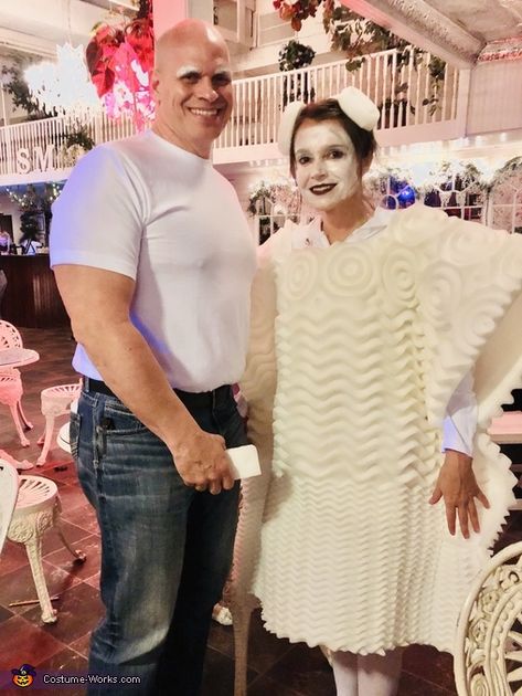 Brandy: My husband is mr clean and I’m the magic eraser. Idea was mine. I had to get a twin mattress pad that resembled a magic easer. I cut a whole... Mr Clean Halloween Costume Couples, Mr Clean Couples Costume, Mr Clean Halloween Costume, Mr Clean Costume, Original Costume Ideas, Unique Couples Costumes, Flintstones Costume, Fire Costume, Unique Couple Halloween Costumes