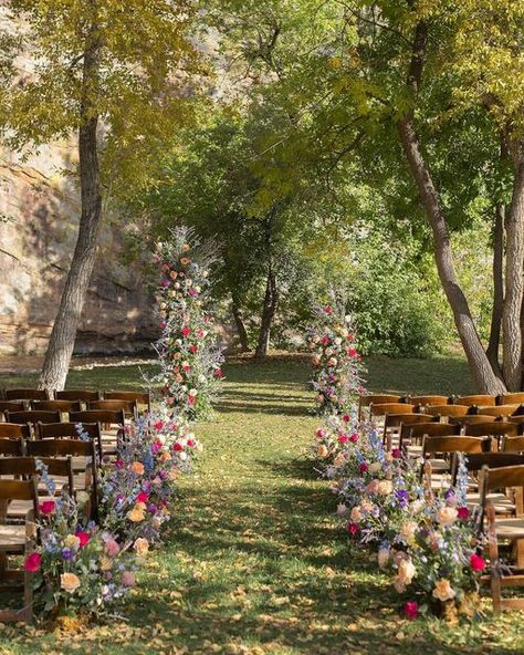 Colorado Wedding Florist on Instagram: "A+D’s whimsical September wedding was one of our favorites from the 2023 season! It was bursting with color and so many locally grown blooms! 💜🌸 : : #septemberbride #planetbluegrasswedding #ceremonyflowers #aislemeadows #floatingarch #floraltowers #whimsicalweddingflowers #whimsicalfloraldesign #coloradoweddingflorist #coloradogrownflowers #dreamceremony #septemberweddingflowers #aisleflowers #cosmosdaisies #dahlialove #colorfulweddingflowers #vibrantweddingflowers #floralbaddies #intothewoodswego #fallweddingceremony" Whimsical Country Wedding, Whimsical Wedding Fall, October Wildflower Wedding, Wedding Venues Flowers, Wild Flower Wedding Decorations, Wedding Ideas Wildflowers, September Wedding Aesthetic, Autumn Wildflower Wedding, September Garden Wedding