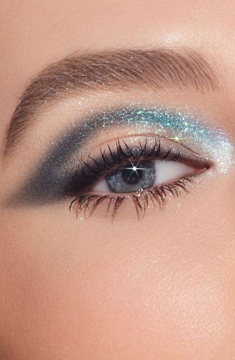 What it is: An all-in-one galaxy-inspired eyeshadow collection for instant on-the-go to ultraglam looks.What it does: Inspired by explosively sparkling, star-filled galaxies, this palette contains 12 pigmented eyeshadows ranging from neutral to turquoise tones in matte and intensely reflective metallic finishes. This essential collection features an easy-to-blend formula and a versatile color range for creating everything from subtle to dramatic summer eye looks.Shades include:- Galaxy (matte deep blue with bluish-green sparkle)- Space Dust (matte sandstone)- Comet (matte toasted peach)- Eclipse (matte muted plum)- Supernova (duo-chrome pink lilac with multidimensional sparkle )- Mars (matte rusty brown)- Dark Matter (matte black violet)How to use: Apply light eyeshadow shades to accentuat Sparkly Glam Makeup, Homecoming Eyeshadow Looks, Eye Makeup With Stars, Turquoise Makeup Looks For Brown Eyes, Galaxy Makeup Looks Easy, Hooded Eye Makeup Eyeshadow, Night Court Makeup, Blue Eyeshadow Hooded Eyes, Purple Waterline Makeup