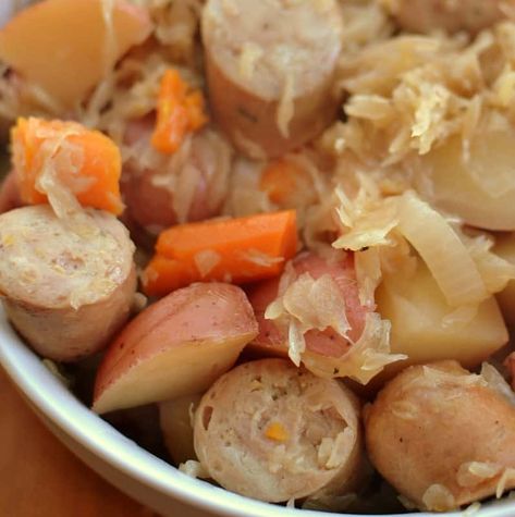 Slow Cooker Sausage Sauerkraut and Potatoes Slow Cooker Sauerkraut, Sauerkraut And Potatoes, Sauerkraut And Sausage, Slow Cooker Sausage, Sausage Sauerkraut, Small Town Woman, Crock Pot Potatoes, Kielbasa Recipes, Potatoes And Carrots