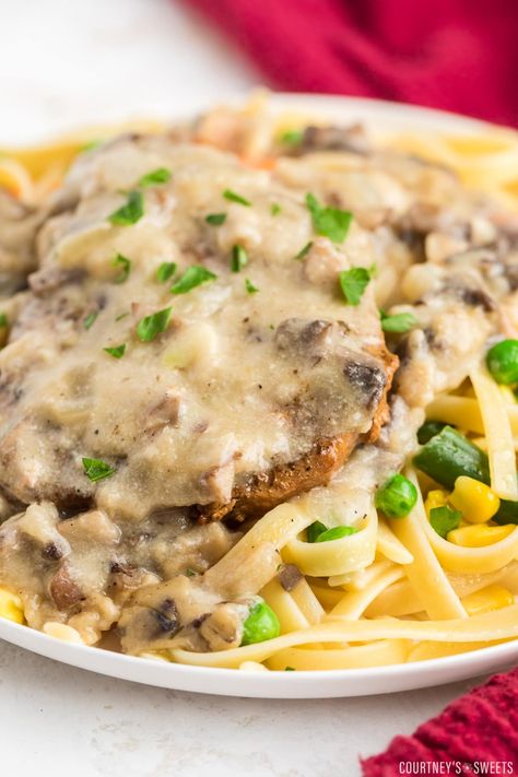 Juicy, tender Baked Cream of Mushroom Pork Chops. Enjoy these pork chops with flavorful mushroom gravy over rice, pasta, or mashed potatoes. Pork Chops Cream Of Mushroom, Soup Egg Noodles, Baked Pork Loin Chops, Cream Of Mushroom Pork Chops, Mushroom Soup Pork Chops, Pork Loin Chops Recipes, Baked Boneless Pork Chops, Baked Pork Loin, Boneless Pork Ribs