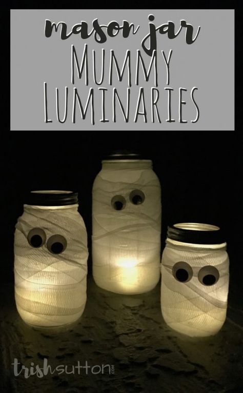 Mason Jar Mummy Luminaries are a simple and silly way to add Halloween cheer both outdoors and indoors. Along with the Mason Jars you will need a roll or two of first aid gauze and tea lights or candles. (Add my favorite battery operated tea lights and you won't even have to remember to light your mummies at night - they have timers!) TrishSutton.com Thanksgiving Yard Decorations, Mummy Jar, Halloween Luminaries, Mummy Crafts, Mason Jar Luminaries, Spooky Halloween Decor, Stag And Doe, Halloween Mason Jars, Battery Operated Tea Lights