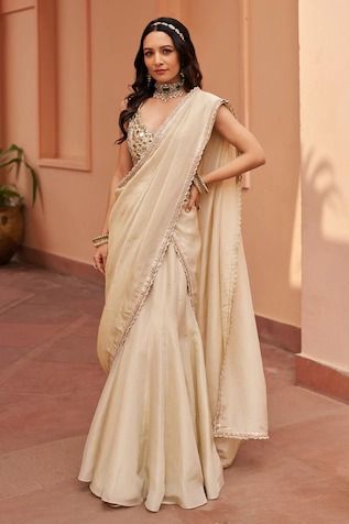 Buy White Satin Modal Embellished Threads V Floral Embroidered Draped Saree Gown For Women by GEE SIN by Geetanjali Singh Online at Aza Fashions. Tissue Lehenga, V Neck Lehenga, Lehenga Sari, Off White Saree, Ivory Bridesmaid Dresses, Gaurav Gupta, Navratri Dress, Bridesmaid Saree, Wedding Lehenga Designs