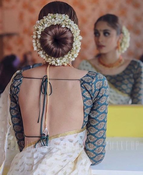 Find the best hairstylist around you  #wedding #indianwedding #hairstyle #bun #gajra #flowers #hairstylist #blouse #backless #shaadisaga Shaadi Lehenga, Indian Hairstyles For Saree, Indian Bun Hairstyles, New Bridal Hairstyle, Bridal Hairstyle Indian Wedding, Hair Style On Saree, Wedding Bun, Saree Hairstyles, Wedding Bun Hairstyles