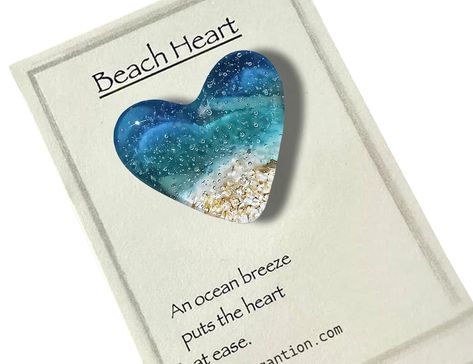 PRICES MAY VARY. 【Express Your Love】These beautiful hearts are a loving reminder of another person, a token of friendship, or a way to symbolize a connection with someone, symbolizing your affection and care. 【Beach Inspiration】This heart in particular was inspired by the beach - the surf, the shell, the jellyfish，the sea, and the sun. It's a beautiful day captured in glass. The aqua blue contrasted against the sand and surf is the perfect way to say "An ocean breeze puts the heart at ease!" 【Ha Workplace Decor, Pocket Heart, Beach Heart, Beautiful Hearts, Beach Inspiration, Pocket Token, Fused Glass Ornaments, Heart Pocket, Glass Beach