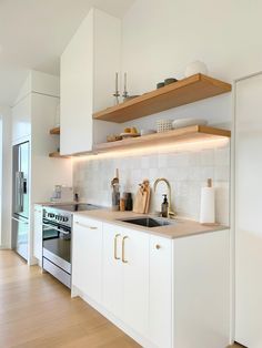 White Kitchen Concrete Benchtop, White Kitchen Brushed Brass Hardware, Vj Kitchen Cabinets, White Oak And Brass Kitchen, Modern Kitchen Design White Natural Wood Open Shelving, Kitchen Oak And White, Kitchen Brushed Brass Hardware, Wood Benchtop Kitchen, White Kitchen Timber Benchtop